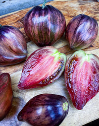 This is Solanum lycopersicum. The common name for this is Rebel Starfighter Tomato. Whimsy and Wonder Seeds sells the freshest of heirloom seeds, vegetable seeds and rare garden seeds. Check this Rebel Starfighter Tomato (Solanum lycopersicum) out along with all of our Heirloom vegetables and rare garden plant seeds here at Whimsy and Wonder Seeds. We ship these garden seeds from Canada to anywhere in the World.